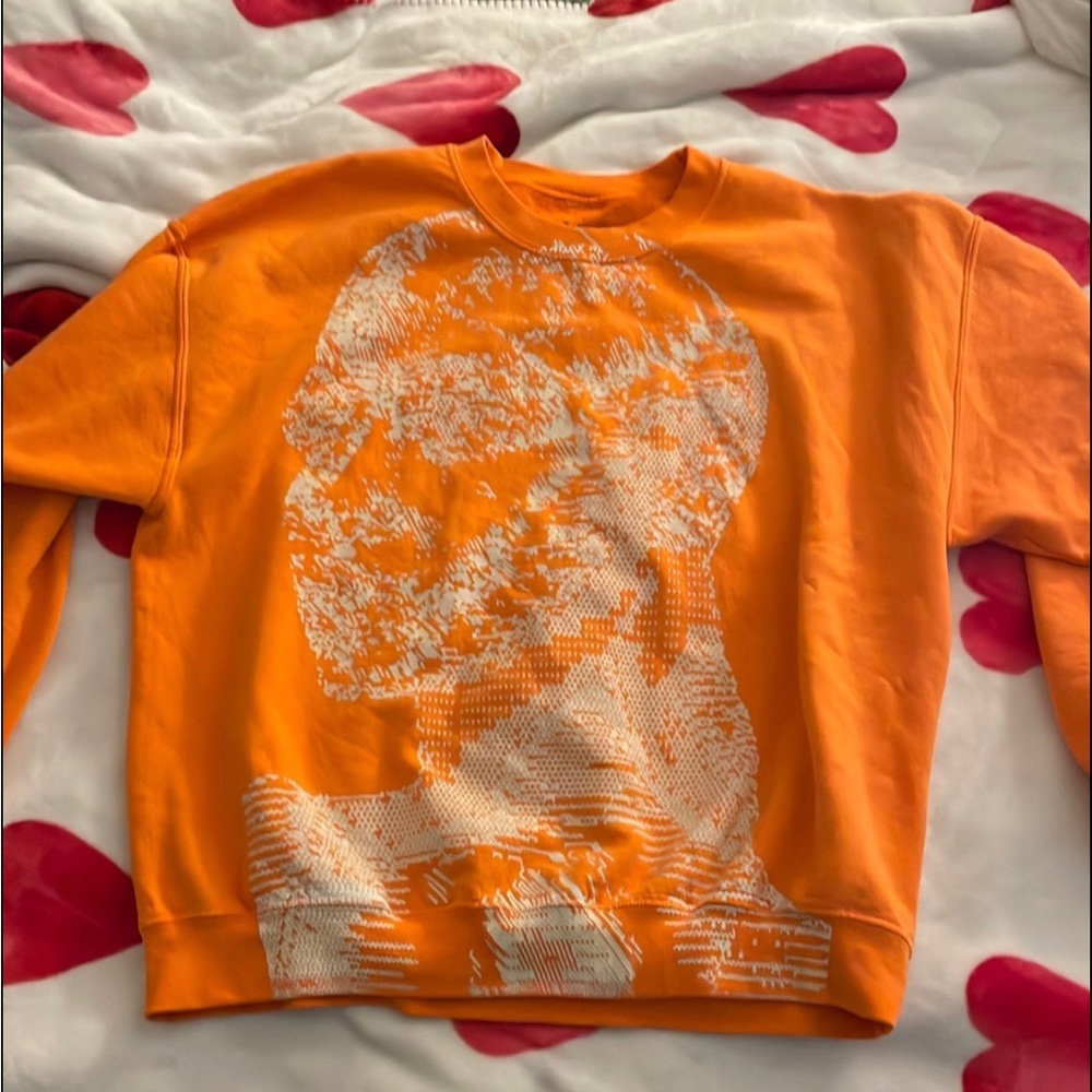 Ariana Grande orange swt crewneck